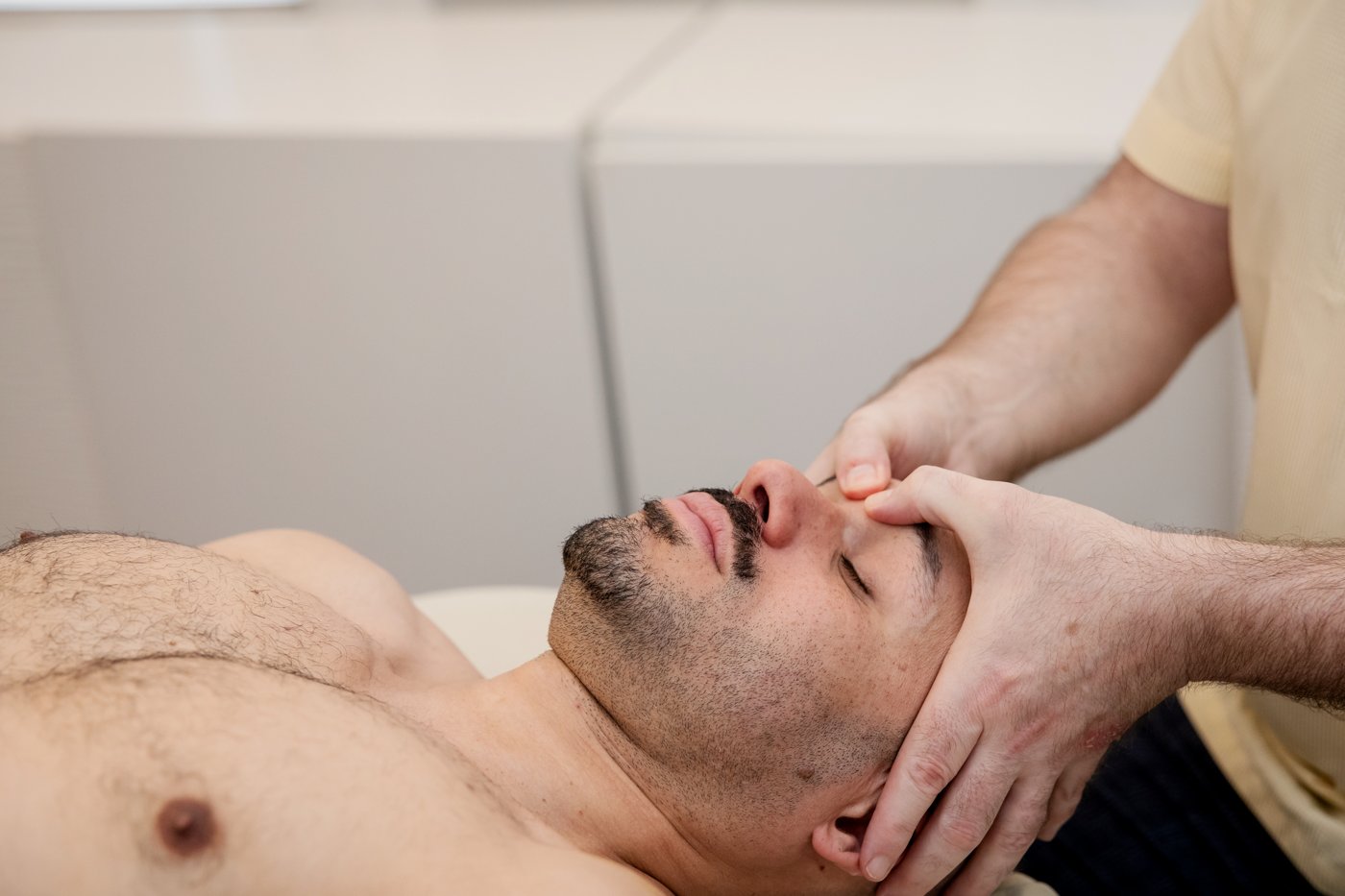 Calming hands-on cranial work during a therapeutic massage session
