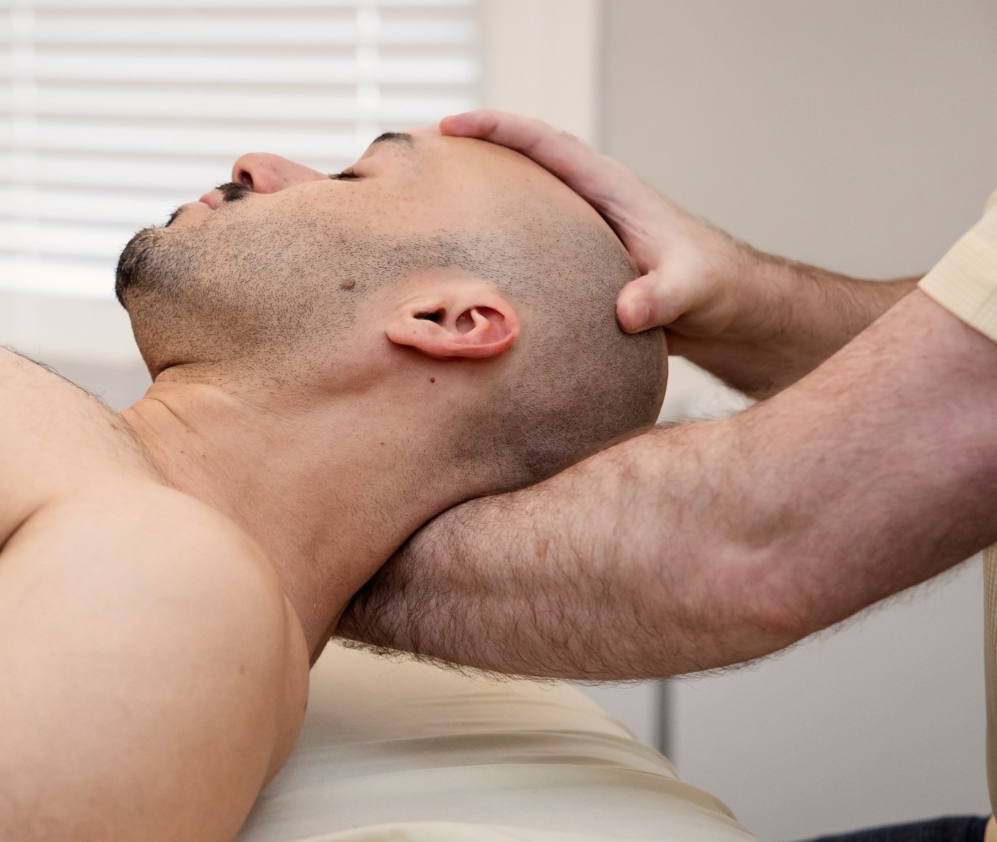John Davis performing focused neck work in his Boston studio
